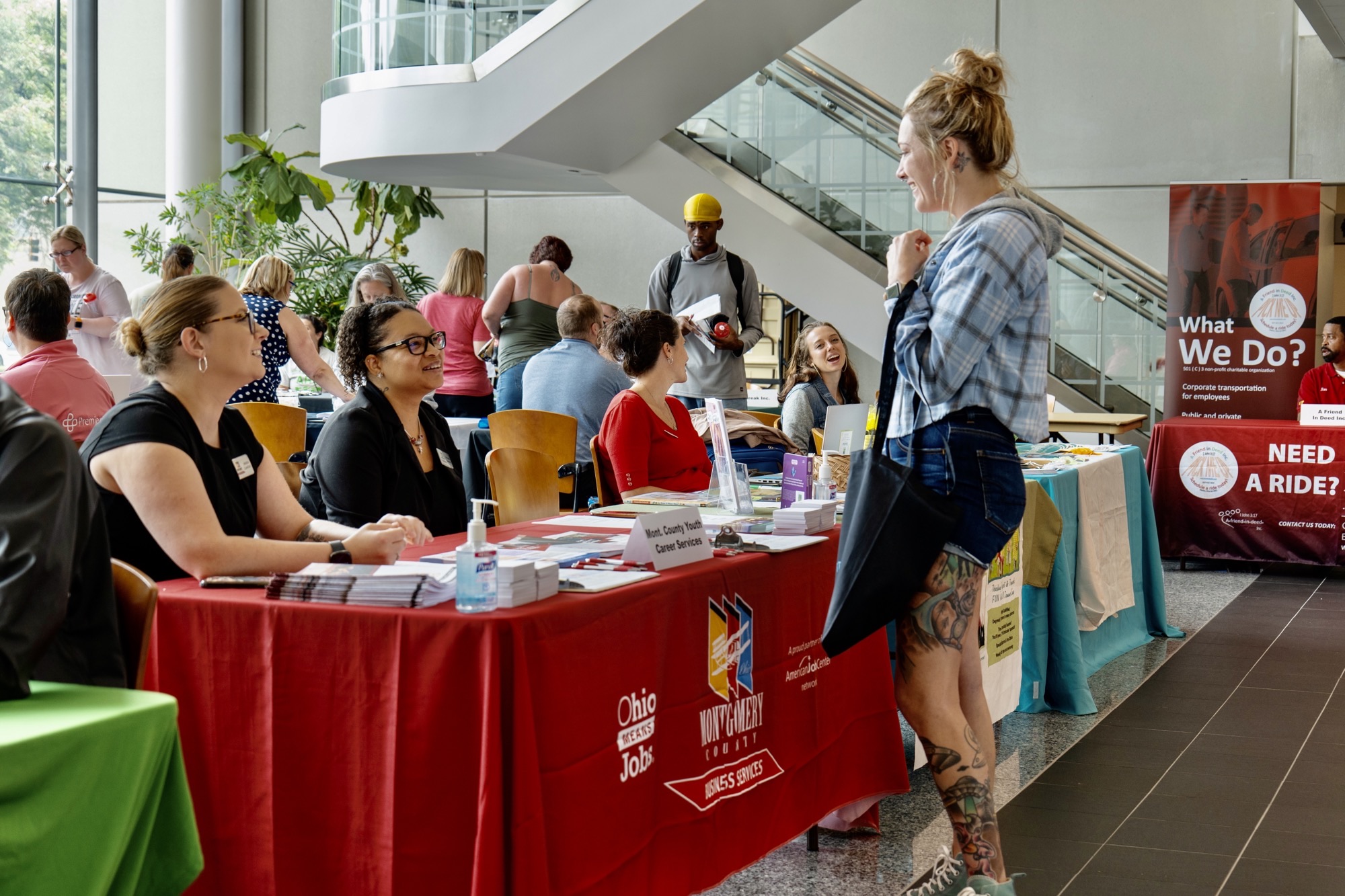 Employers talking with students at career fair.