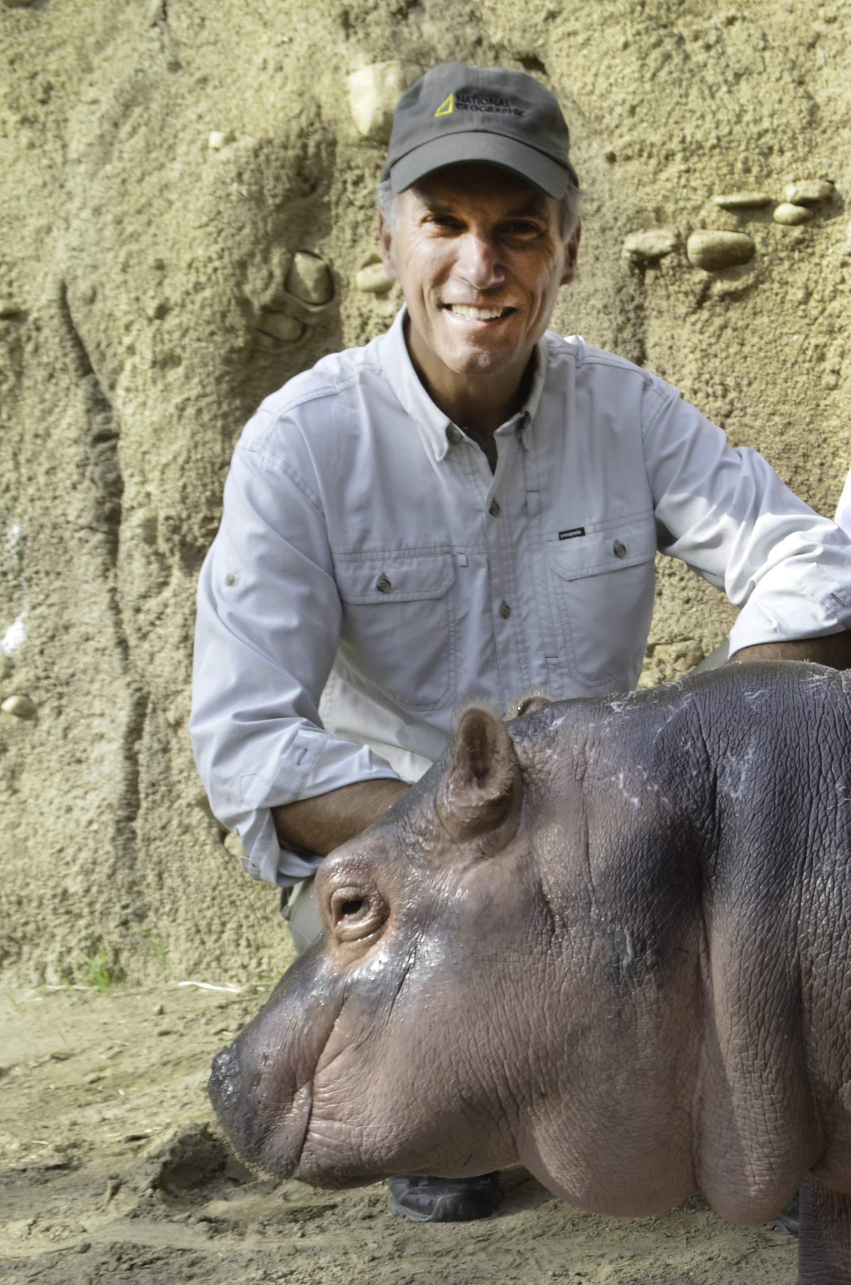 Thane Maynard with baby hippo