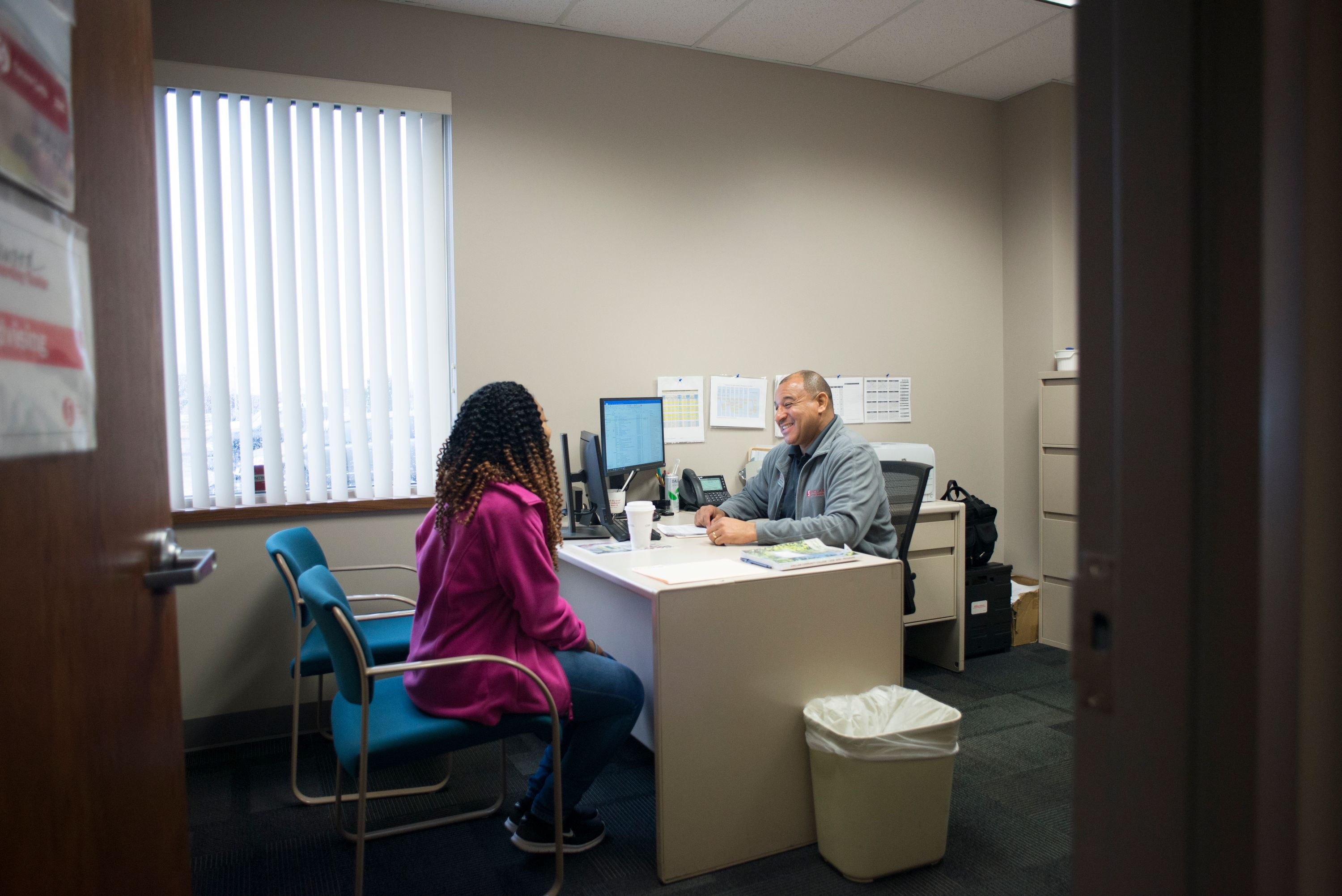 student and staff talking