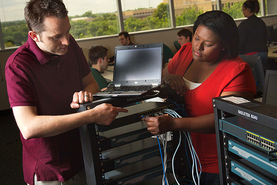 Professionals working on server hardware