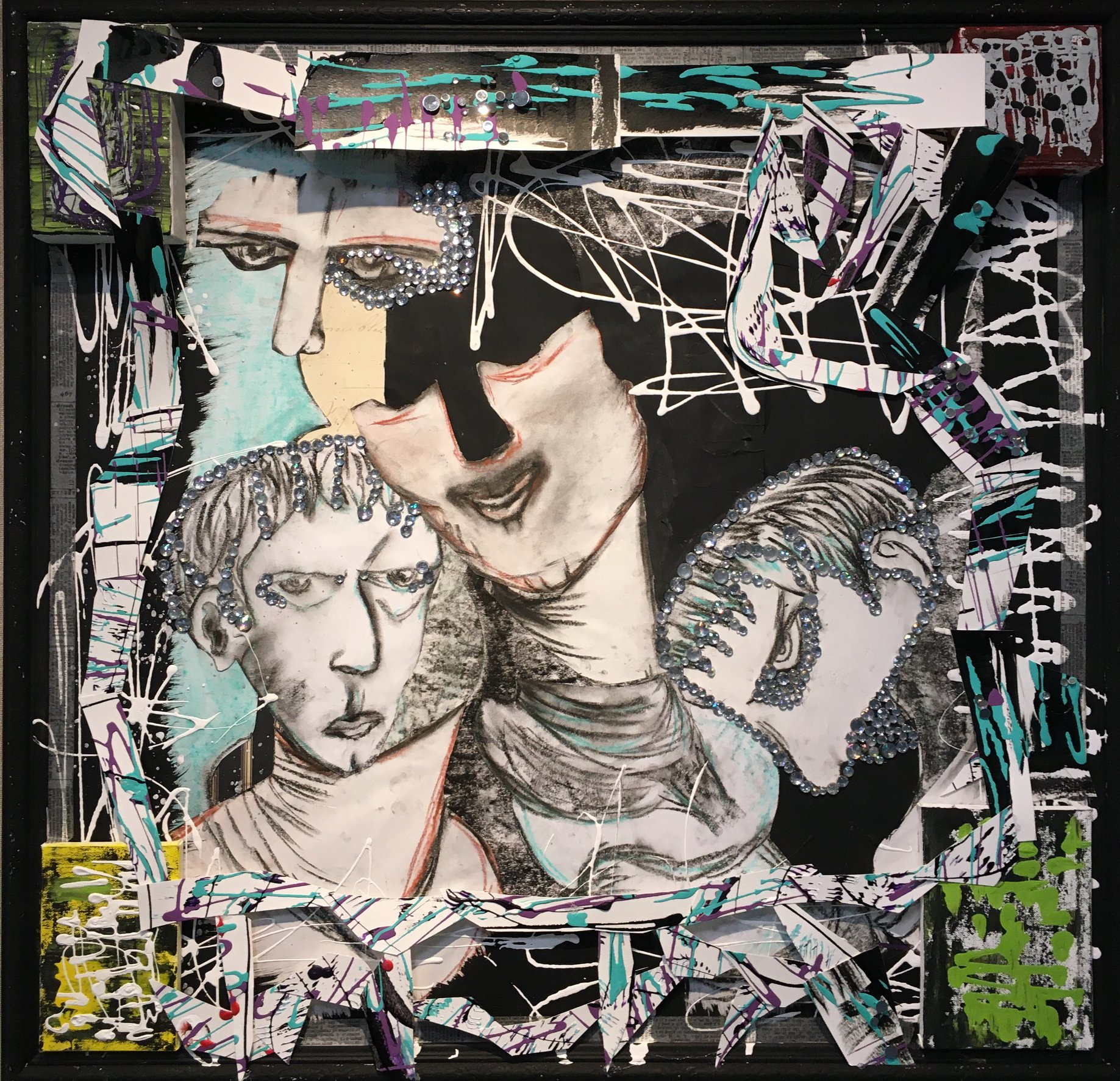 A bejeweled paper collage. Abstracted drawings of three Roman statuesque heads have been cut and reassembled on a black background. Paint splatters add movement and paint splattered paper has been cut and reassembled in a rough perimeter. Dimension is added in each corner by paint splattered blocks.