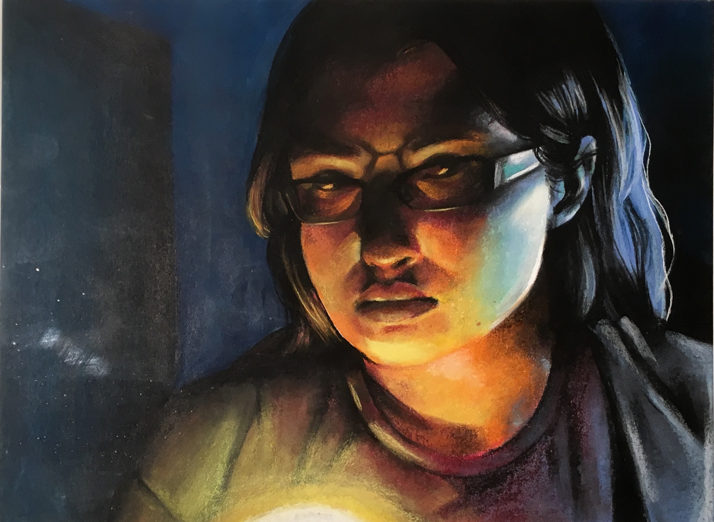This pastel piece is dramatically lit by a light source just below the image area. The portrait of a woman in thin rectangular glasses with dark hair is warmly lit by the light while the back of her hair is cooly lit by another source. The background is a very dark blue with a non-descript rectangular doorway shape. She is looking past us to the right and the chiaroscuro gives the piece an overall pensive feeling.