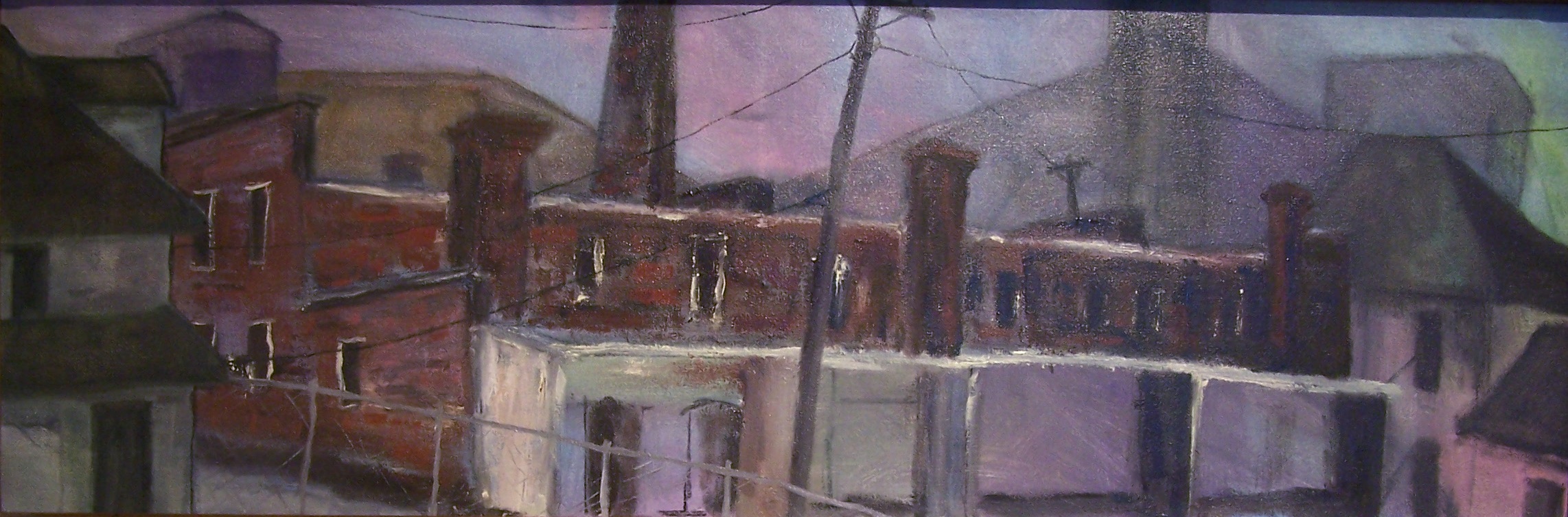 A painting of an industrial landscape. It’s about three times as wide as it is high. There are electric lines and poles moving through the work with multiple buildings. The central one, taking up the most space, is a brick-red building with a smoke tower. Other buildings surround it. There is a chain link fence nearer to the viewer. The colors are fairly muted throughout the work with areas of pinks, purples, whites, grays and blues. Dark rectangles of windows and shadows repeat through the work.