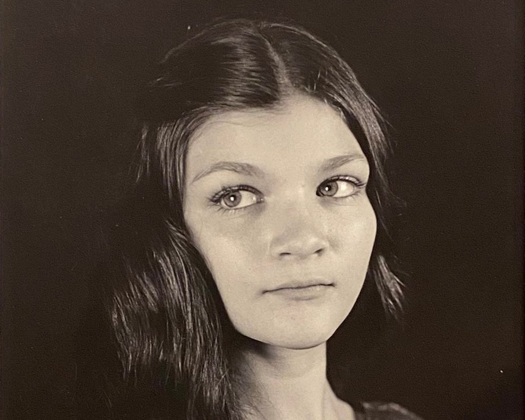 A black and white photograph of a young woman's face looking to the left - click on this image to access the ZoneVI Gallery Website